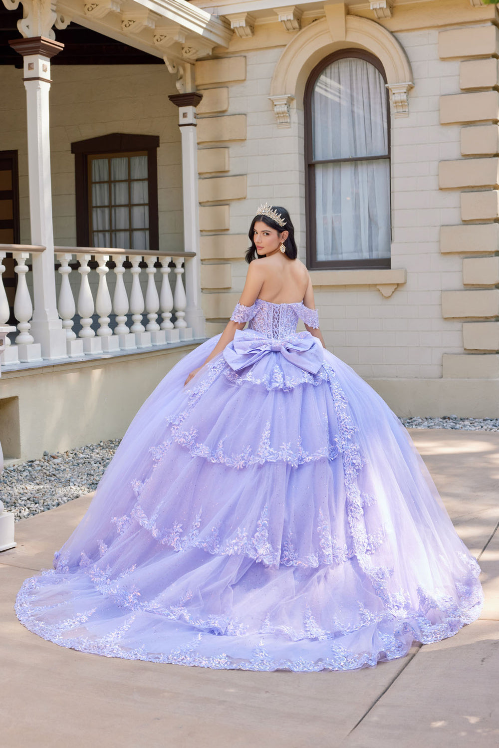 Juliet JT1507J layered floral appliqué quinceanera ball gown back view with bow and train