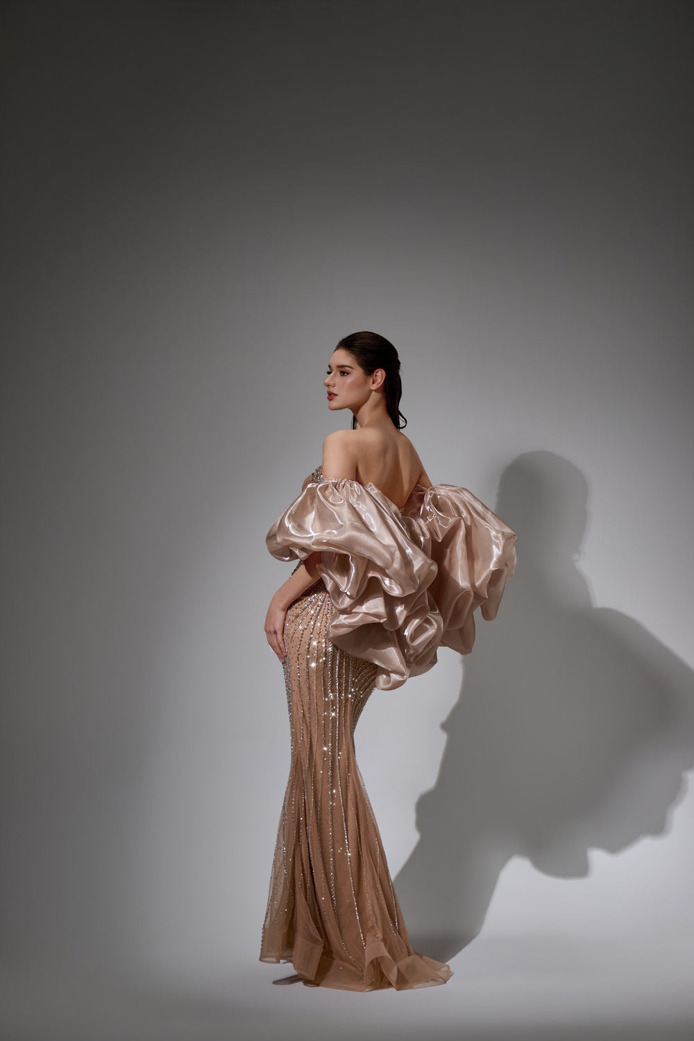 Delilah LD21161 Strapless Swirl Crystal Corset Mermaid Gown with Puff Sleeves and Slit - Champagne back view