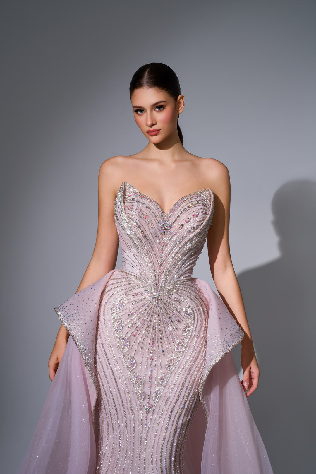 Delilah LD12089 Strapless Plunging Crystal Mermaid Gown with Peplum and Tulle Overskirt - Pink close-up view