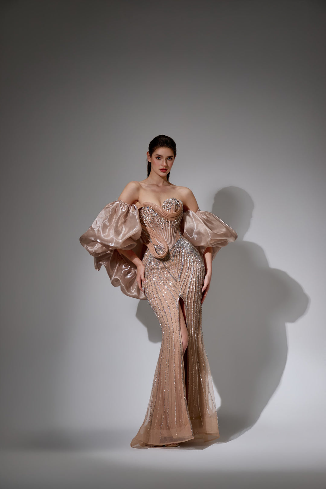 Delilah LD21161 Strapless Swirl Crystal Corset Mermaid Gown with Puff Sleeves and Slit - Champagne front view