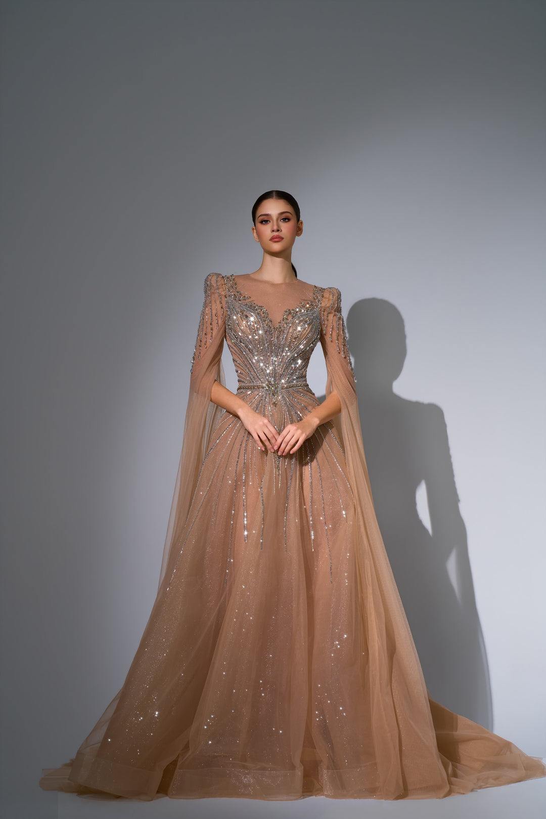 Delilah LD11670 Illusion Neck Long Sleeve Cape Beaded A-Line Gown - Champagne front view