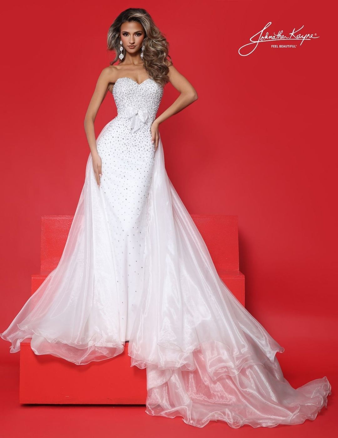 Johnathan Kayne 3356 strapless pageant gown with bow and overskirt front view