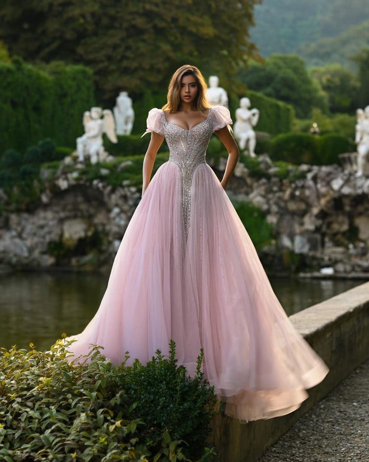 Delilah SH11608 Plunging Beaded Corset Ball Gown with Puff Sleeves - Pink front view